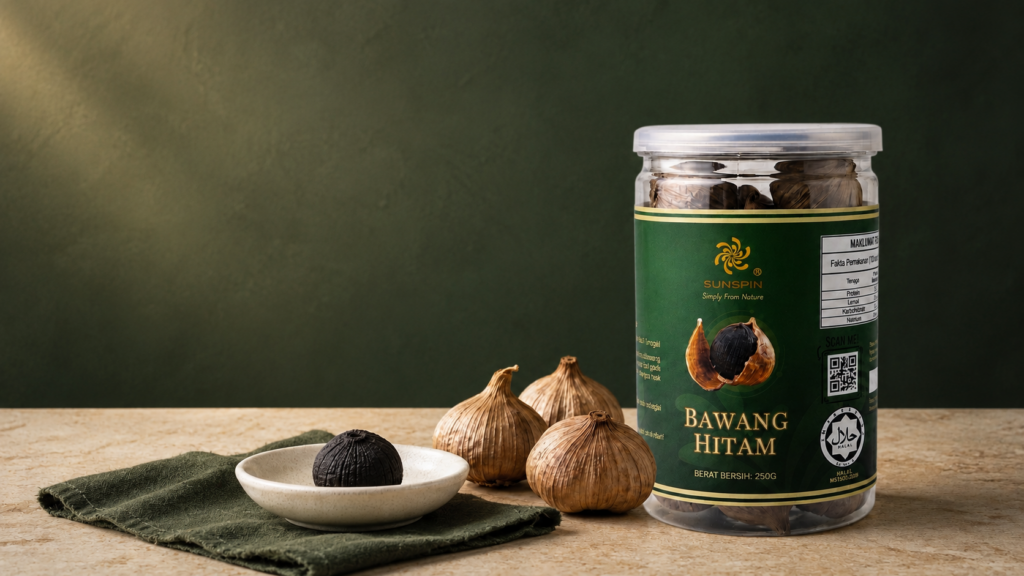 Sunspin Solo Black Garlic with whole round black garlic on a warm wooden table